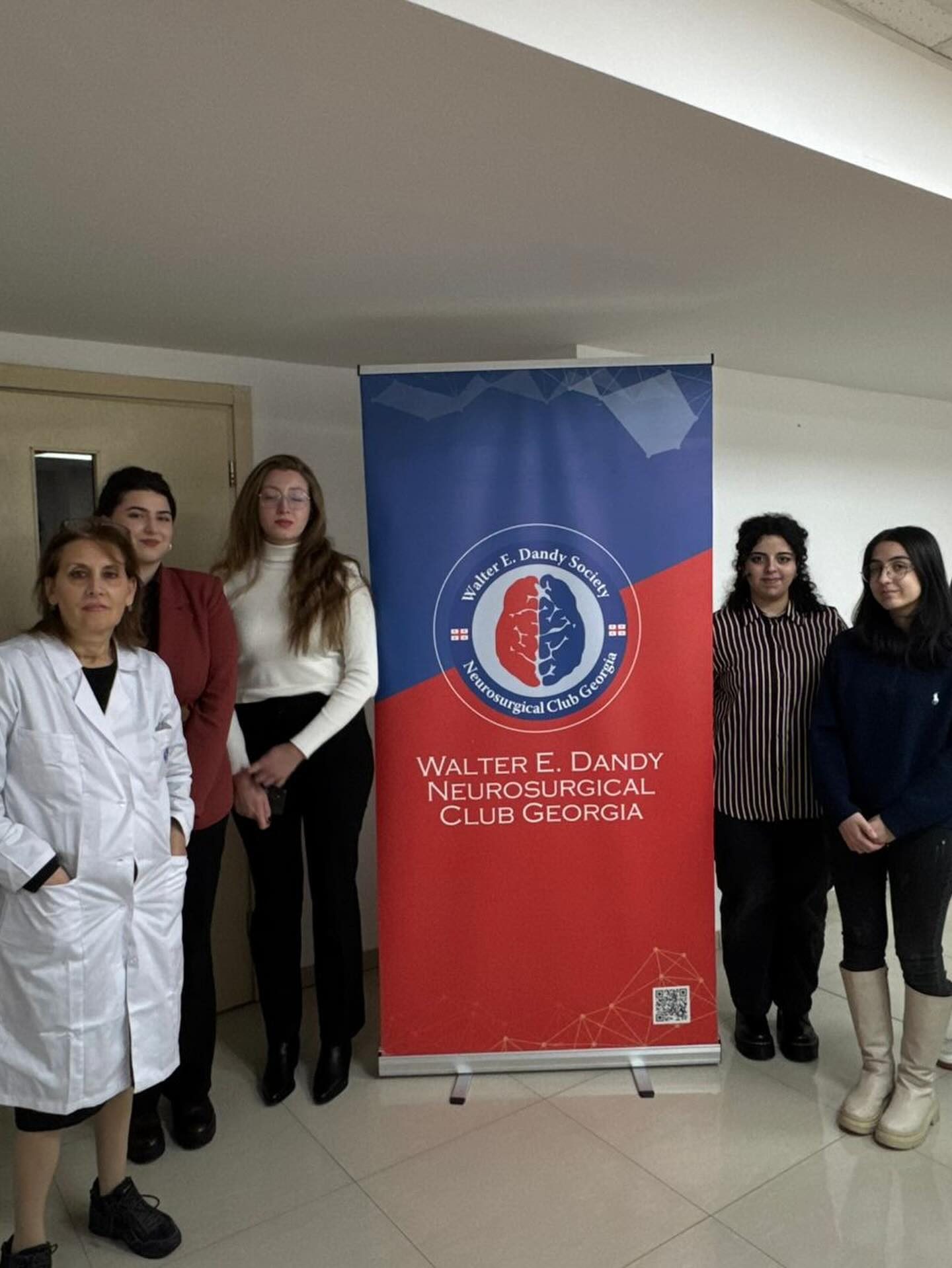 Students with the Dandy Georgia banner at the clinic